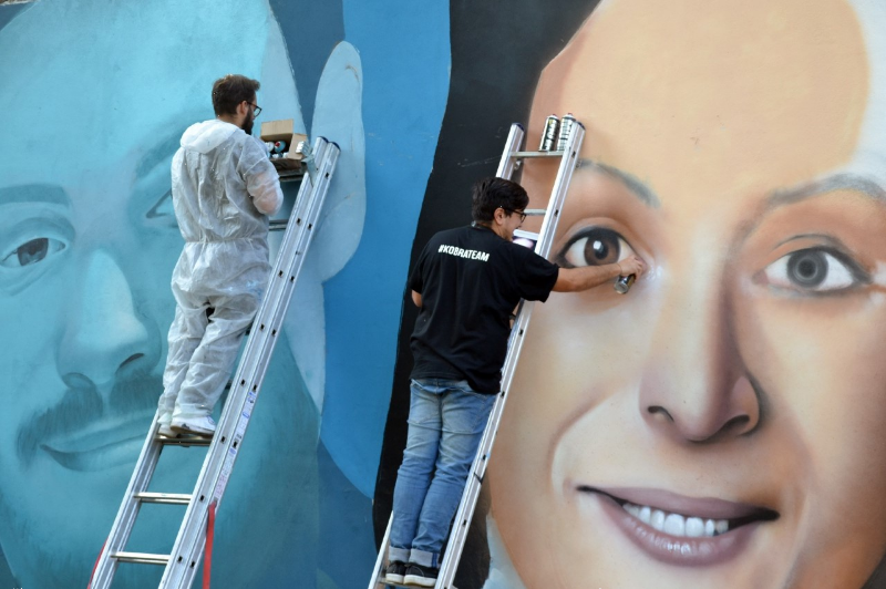 Al Tempio del Futuro Perduto appaiono i volti di Giulio Regeni e Valeria Solesin, opera di Rosk e Loste